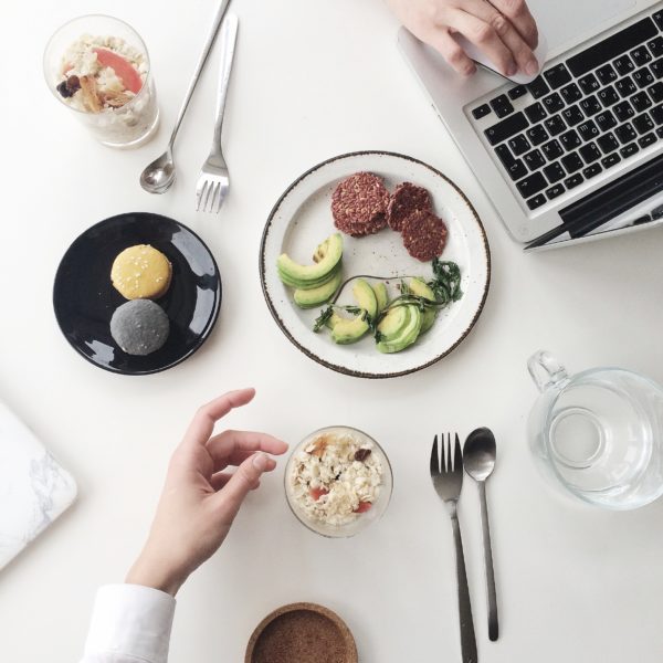 Photo of White Plate Beside Macbook