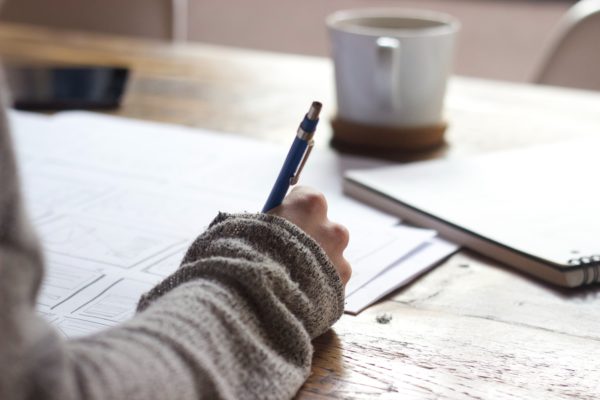 person writing with right hand